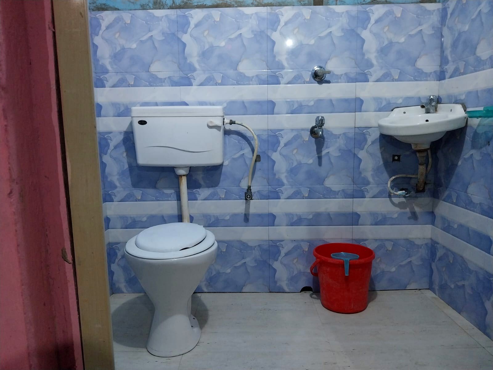 Clean modern bathroom with blue marbled wall tiles